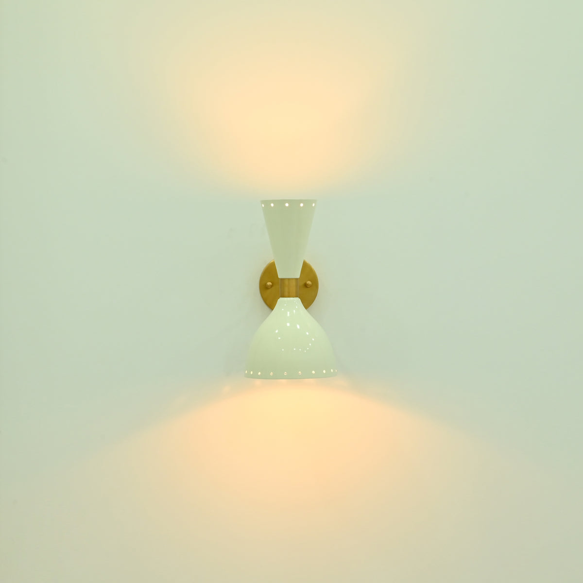 Amsterdam diabolo wall light installed beside a bed in a modern bedroom with warm ambient illumination