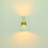 Amsterdam diabolo wall light installed beside a bed in a modern bedroom with warm ambient illumination
