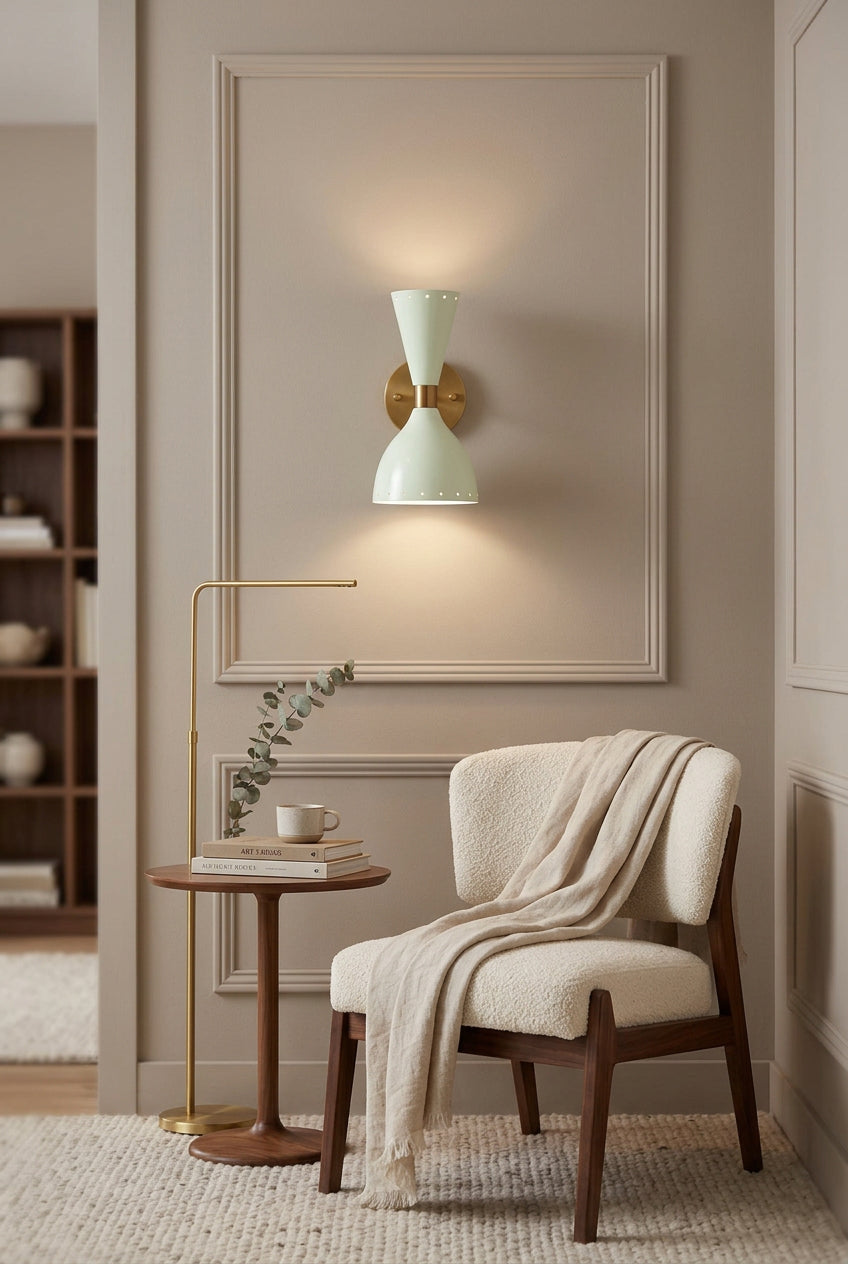 Enamel painted wall sconce with raw brass arm, center fitting and circular wall canopy