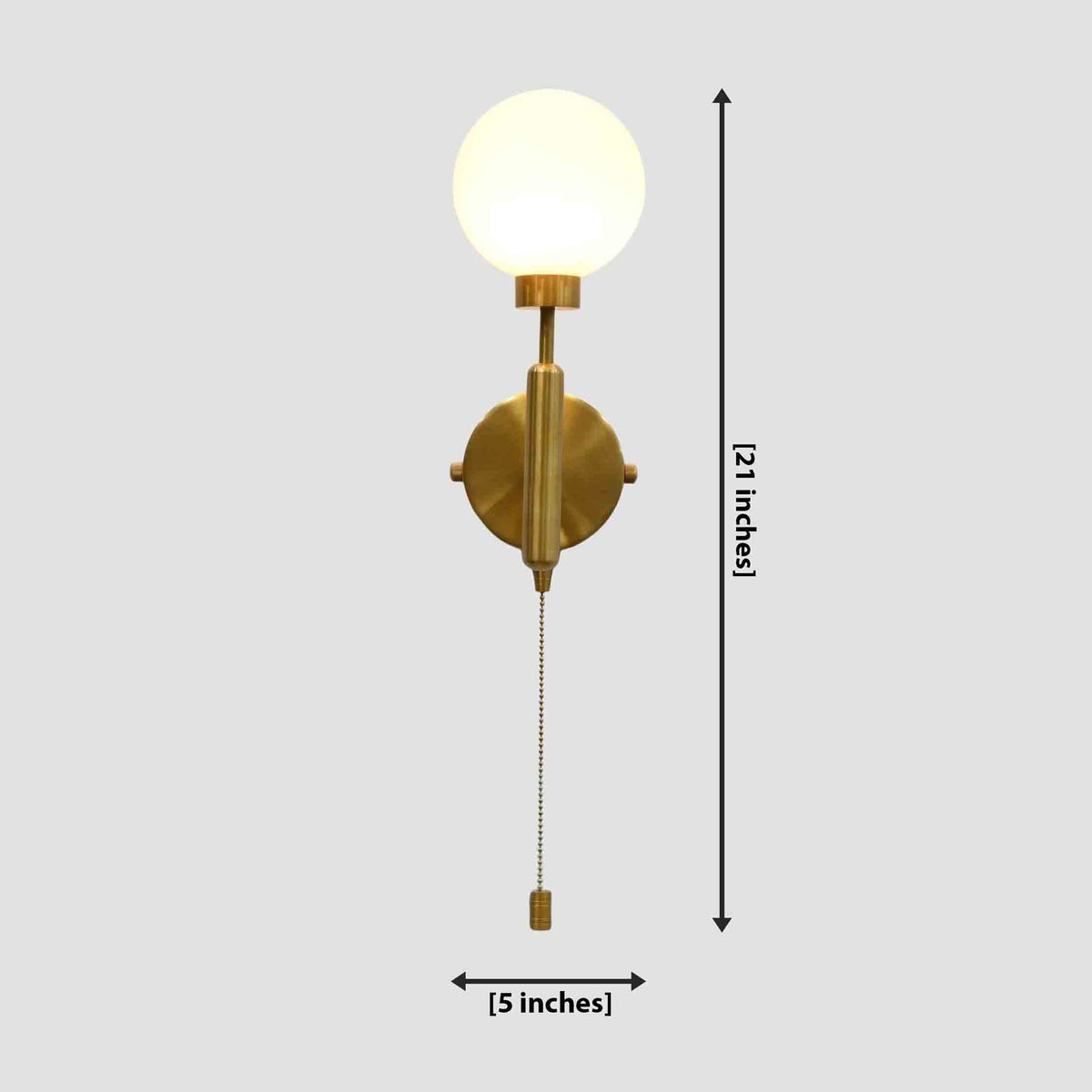 Antwerp pull chain globe wall sconce in raw brass finish with glowing opal glass globe and brass chain switch
