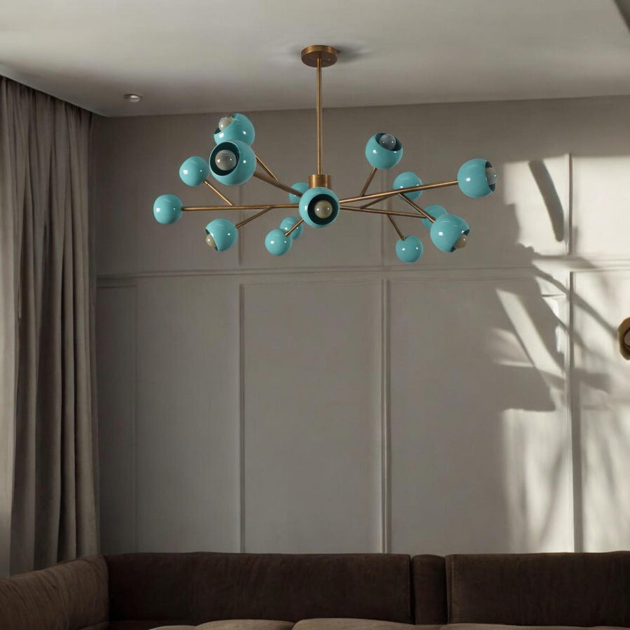 Mid-century brass chandelier with twelve aqua blue globes radiating from a central brass hub, creating a vibrant sputnik-inspired design.