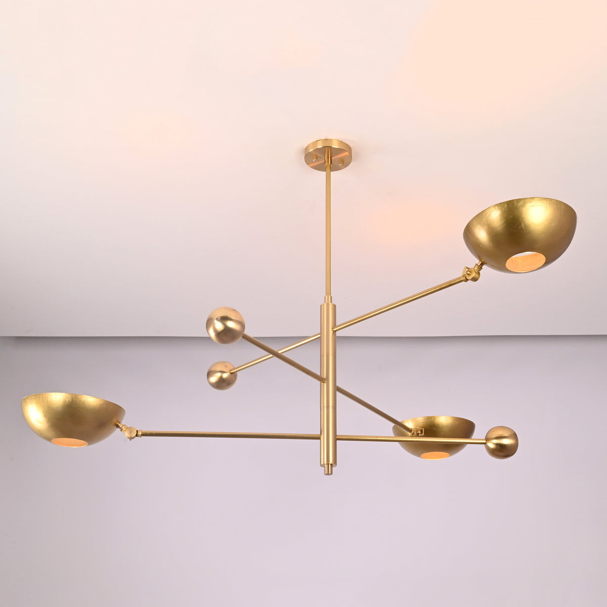 Architectural brass disc chandelier with offset horizontal arms and solid brass detailing