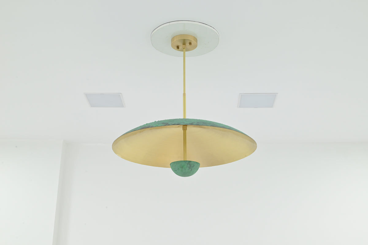 Solid brass dome chandelier with green verdigris patina exterior and warm brushed brass underside