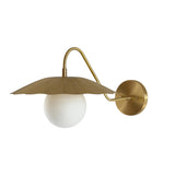Front view of the Aurora modern brass flower shade wall sconce featuring a handcrafted fluted metal shade, frosted globe diffuser, and elegant curved wall arm.
