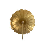 Front view of Aurora modern floral brass wall sconce featuring a sculpted flower-inspired backplate and elegant curved arm in a warm brass finish.