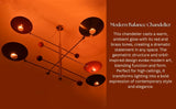Modern brass chandelier casting dramatic lighting with artistic balance design