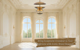 Sculptural brass chandelier in an elegant ballroom with large arched windows and ornate molding.