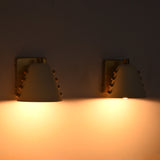 Set of two wall sconces above bathroom vanity mirror with warm light for refined bathroom décor