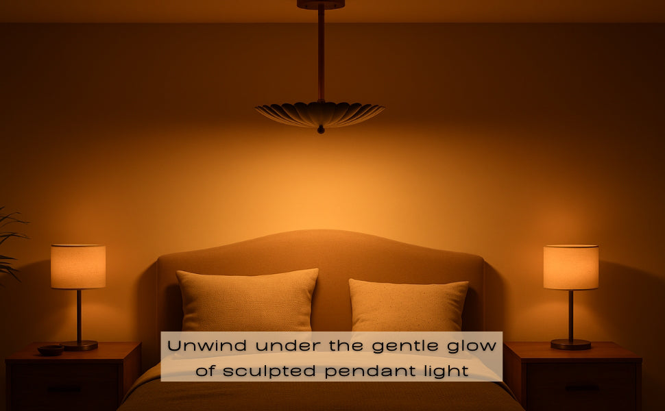 Warm bedroom setting with floral brass pendant light over bed, emitting soft ambient light.