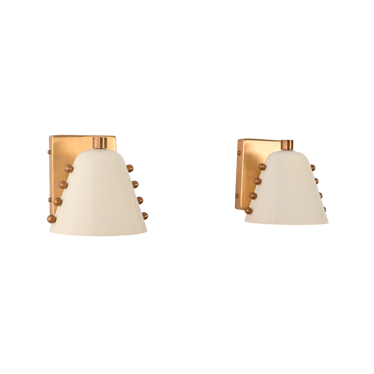 Bedside wall sconce pair creating warm reading light and balanced decorative lighting on both sides of the bed