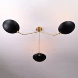 Top view of black and brass bowl chandelier showing elegant curvature of the brass arms and central support.