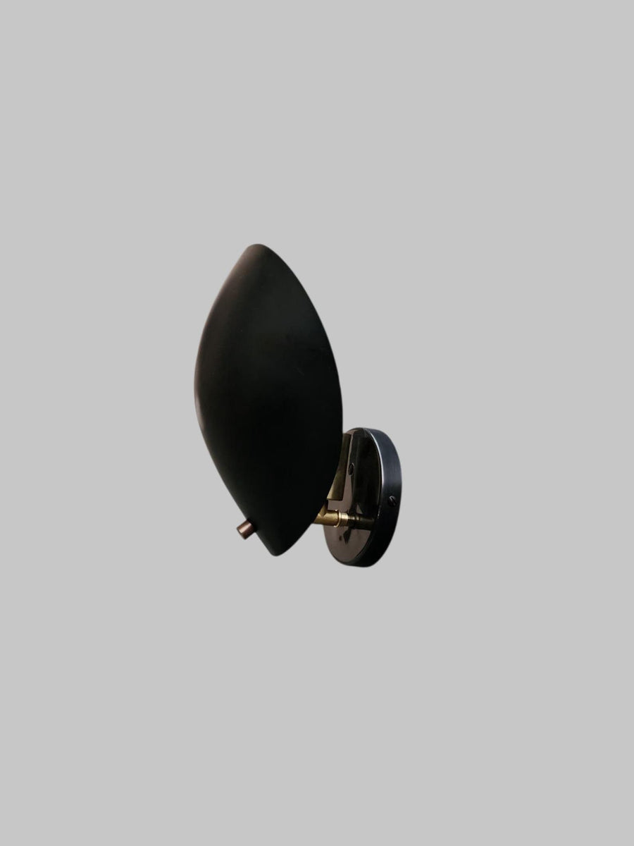 Side view of black brass leaf-shaped wall sconce by Brass Leaf Studio