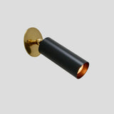 Black and brass adjustable wall spotlight with cylindrical shade and round base