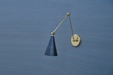 Handmade brass swing arm wall light with black cone shade, industrial design