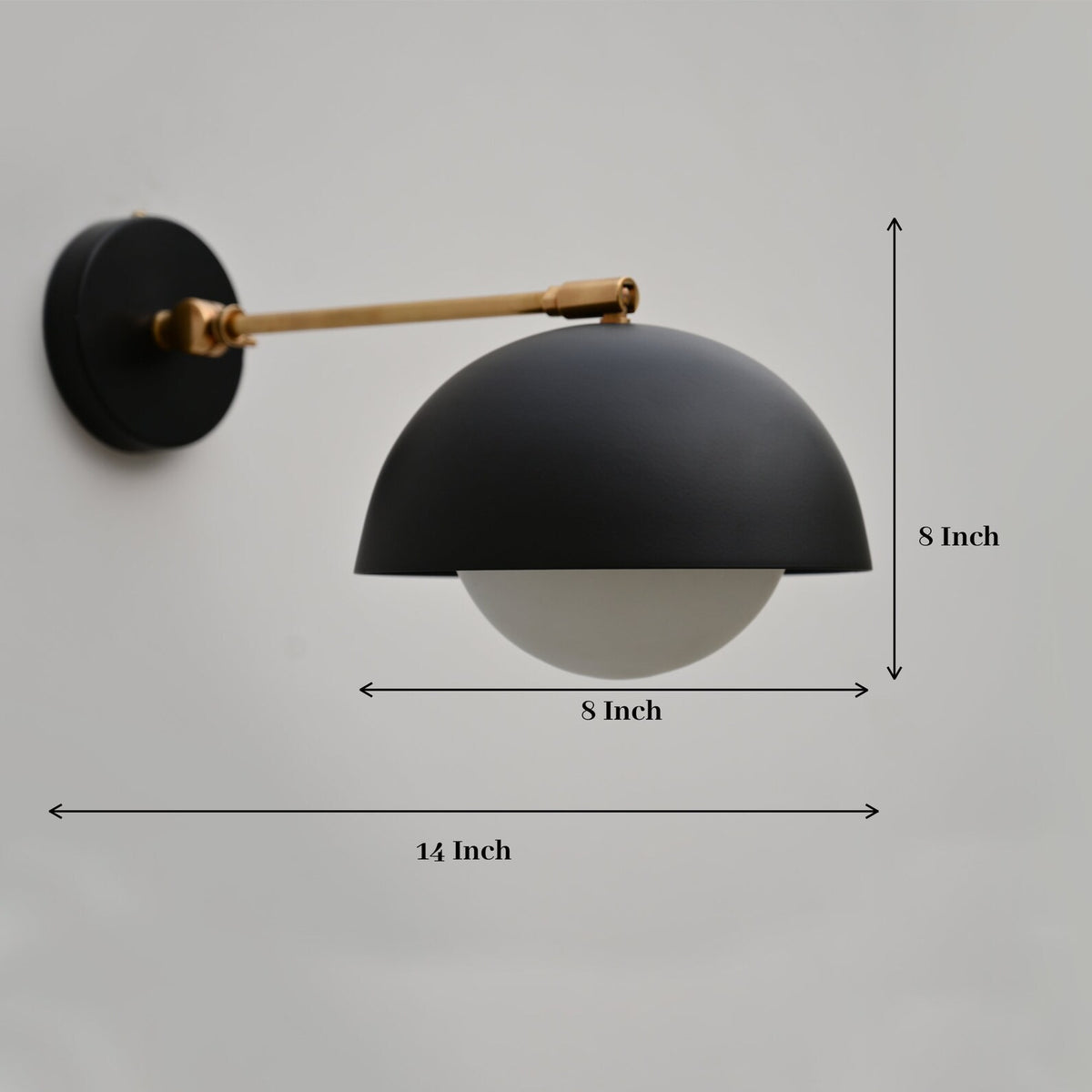 Dimensional view of black dome wall light with 8-inch shade, 14-inch projection, and brass mounting arm.