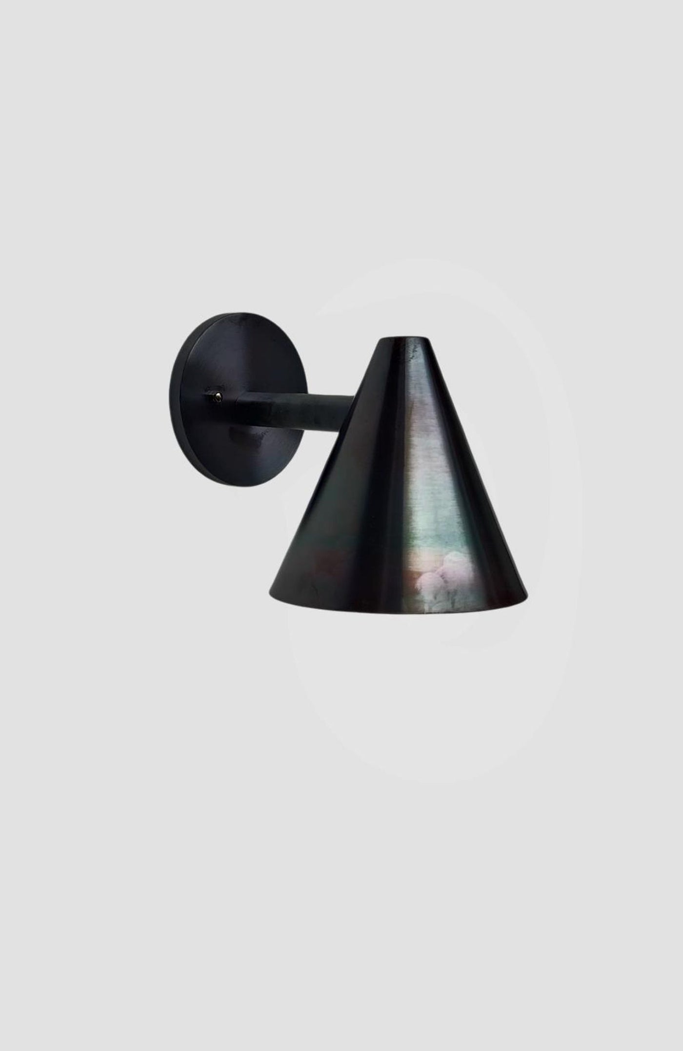 Modern blackened brass cone wall light handcrafted by Brass Leaf Studio, featuring minimalist cone design and matte antique finish.
