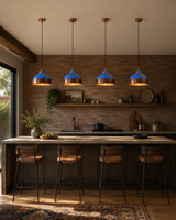 Blue patina solid copper dome pendant light hanging above a kitchen island with warm downward glow
