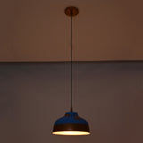 Blue and copper dome pendant lights installed in a hallway, adding warm glow and decorative ceiling lighting