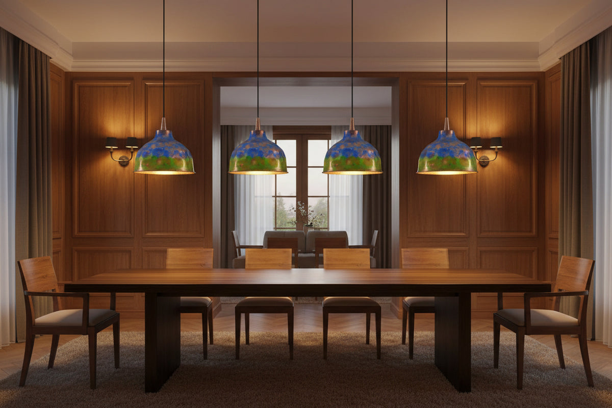 Blue green copper pendant light hanging above a dining table with warm glow and rustic modern style