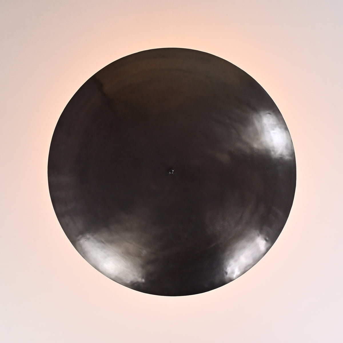 Close-up of solid brass bowl ceiling light showcasing smooth satin finish