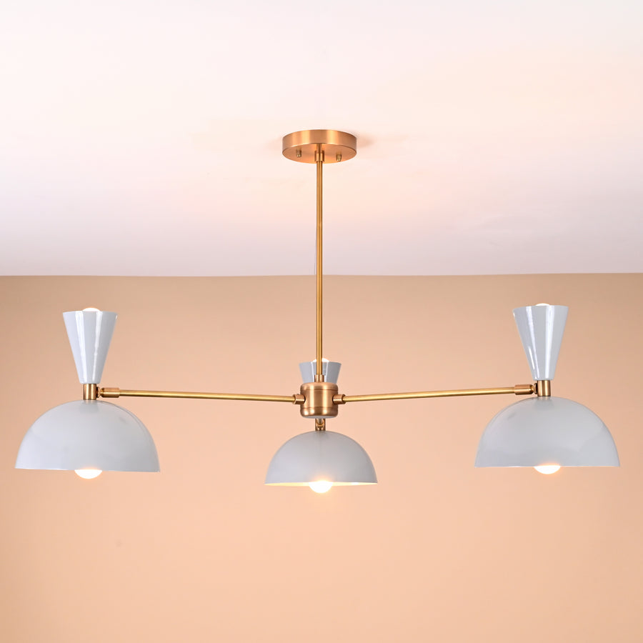Modern brass 3-light chandelier with white bowl shades, front view, handmade by Brass Leaf Studio.