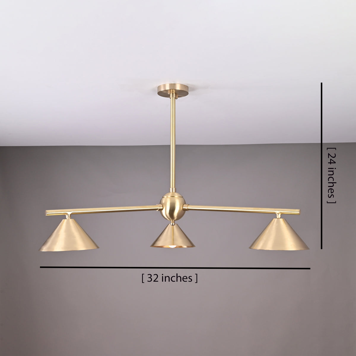 Handcrafted brushed brass 3-light cone chandelier with minimalist arms and sculpted shades, size 32 inches wide and 24 inches high.