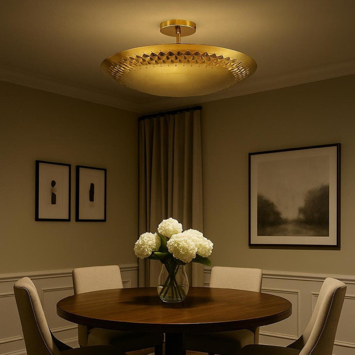 3 light brass disc style flush mount chandelier installed above a dining table