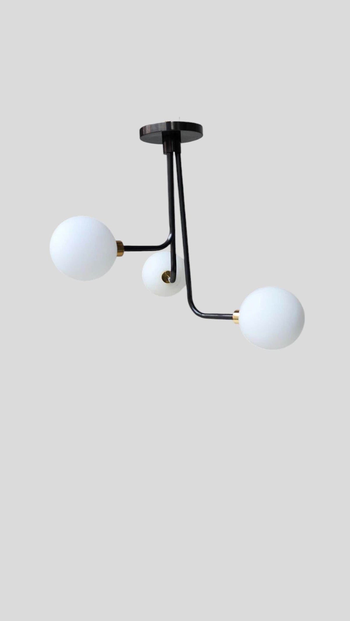 Modern brass 3-light ceiling light with opal globe shades – side angle