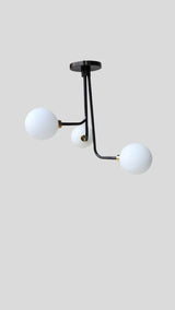 Modern brass 3-light ceiling light with opal globe shades – side angle