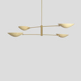 Contemporary brass chandelier with four elegant bowl shades, minimalist handmade design – side angle view.