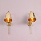 Front view of two brass bell wall sconces with perforated design and brushed brass finish