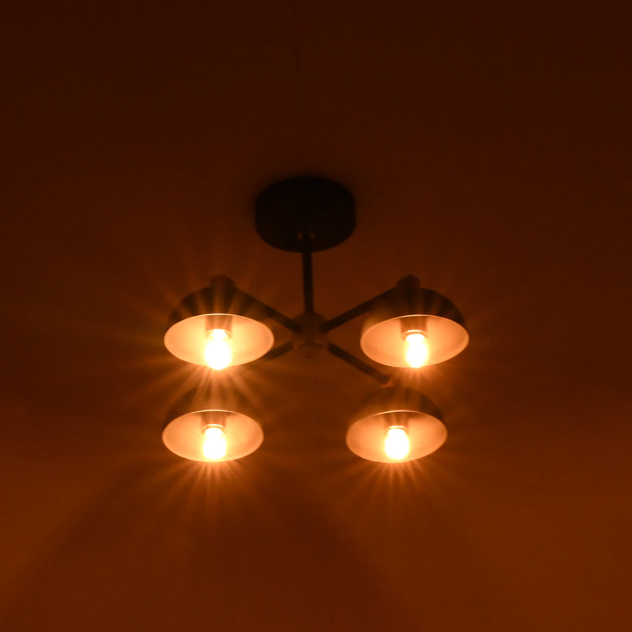 Side angle view of handcrafted brass bowl ceiling light showing industrial arms and warm indirect lighting.
