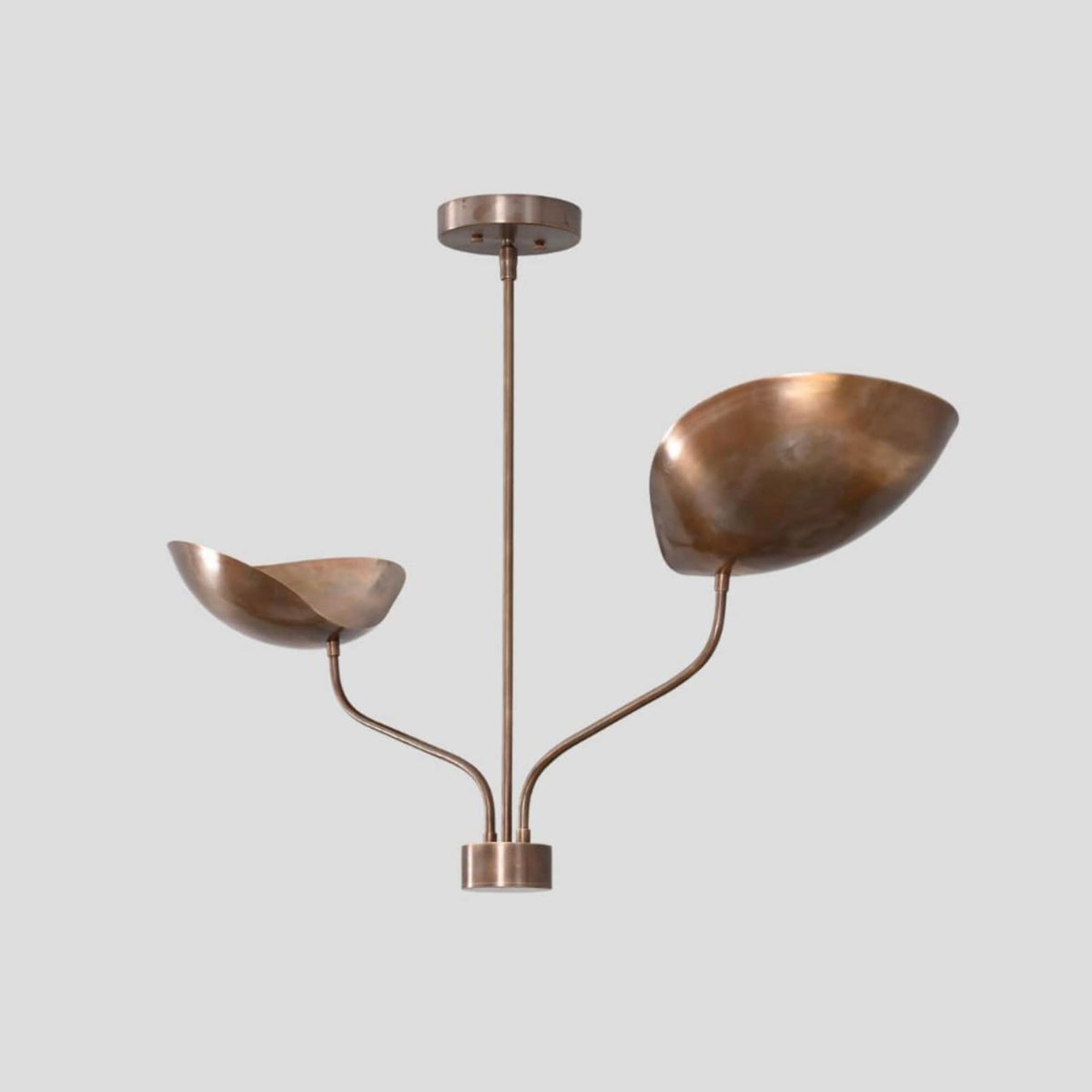 Side angle of handmade brass chandelier featuring sculpted bowl shades and minimalist design for modern interiors.