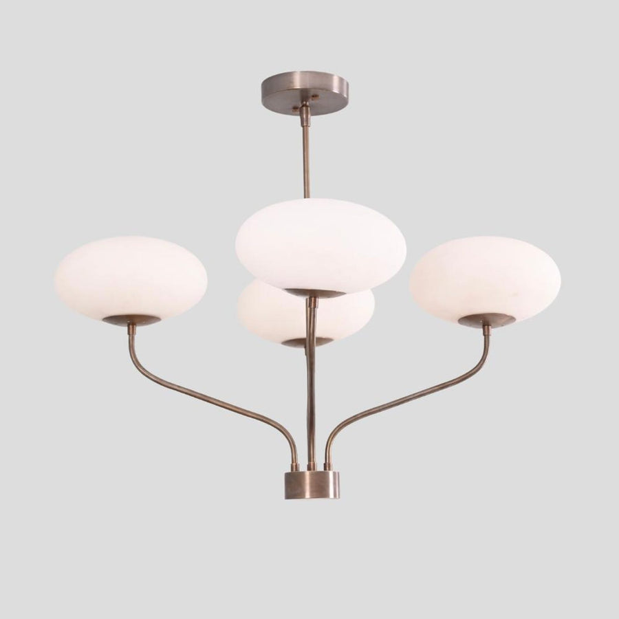 Modern brass chandelier with four bowl-shaped frosted glass shades, handmade ceiling light by Brass Leaf Studio.