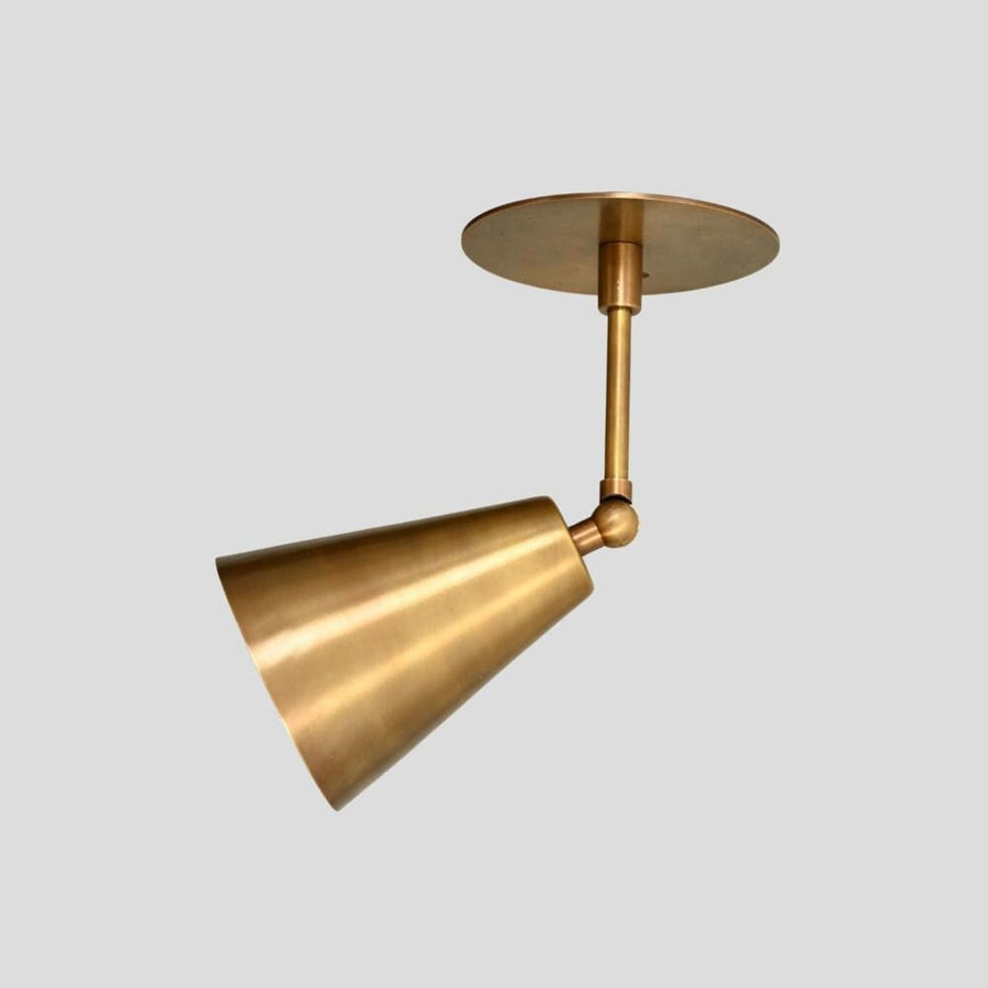 Handmade brass ceiling light with adjustable cone shade in brushed brass finish