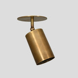 Adjustable brass spotlight ceiling light with tilt function and smooth brushed brass finish