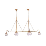 Chain suspended linear chandelier with dual ceiling canopies, brass rods, and six ribbed glass globe lights