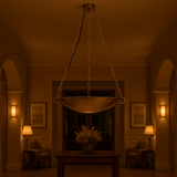 Weighing scale-style brass chandelier glowing warmly in a luxury hallway interior setup