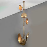 Brass disc chandelier in living space with fireplace, luxury light