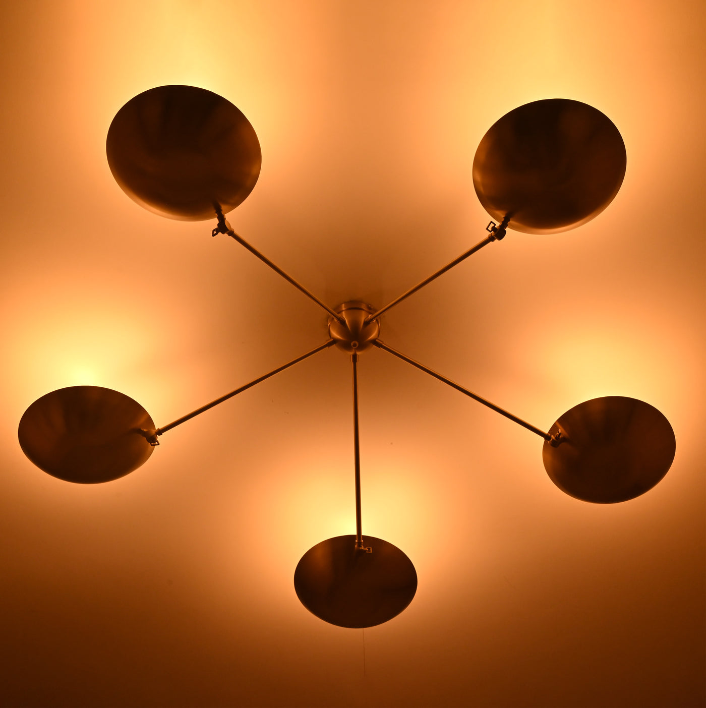 Side View of Brass Flush Mount Chandelier with Ambient Glow