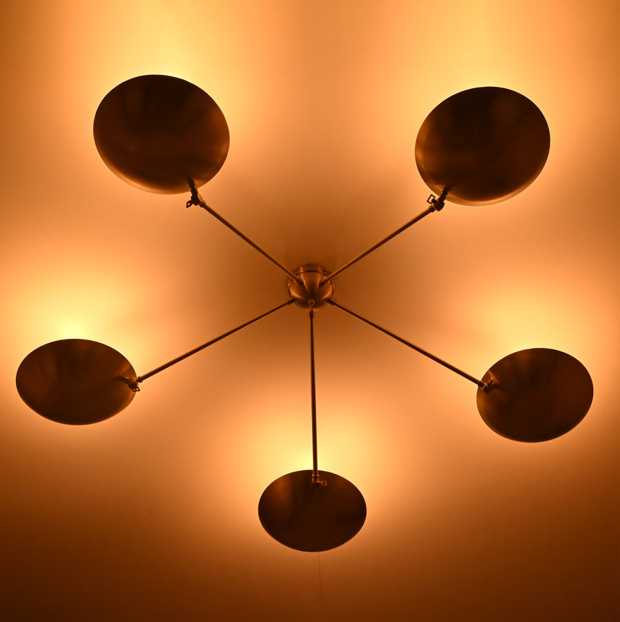 Side View of Brass Flush Mount Chandelier with Ambient Glow