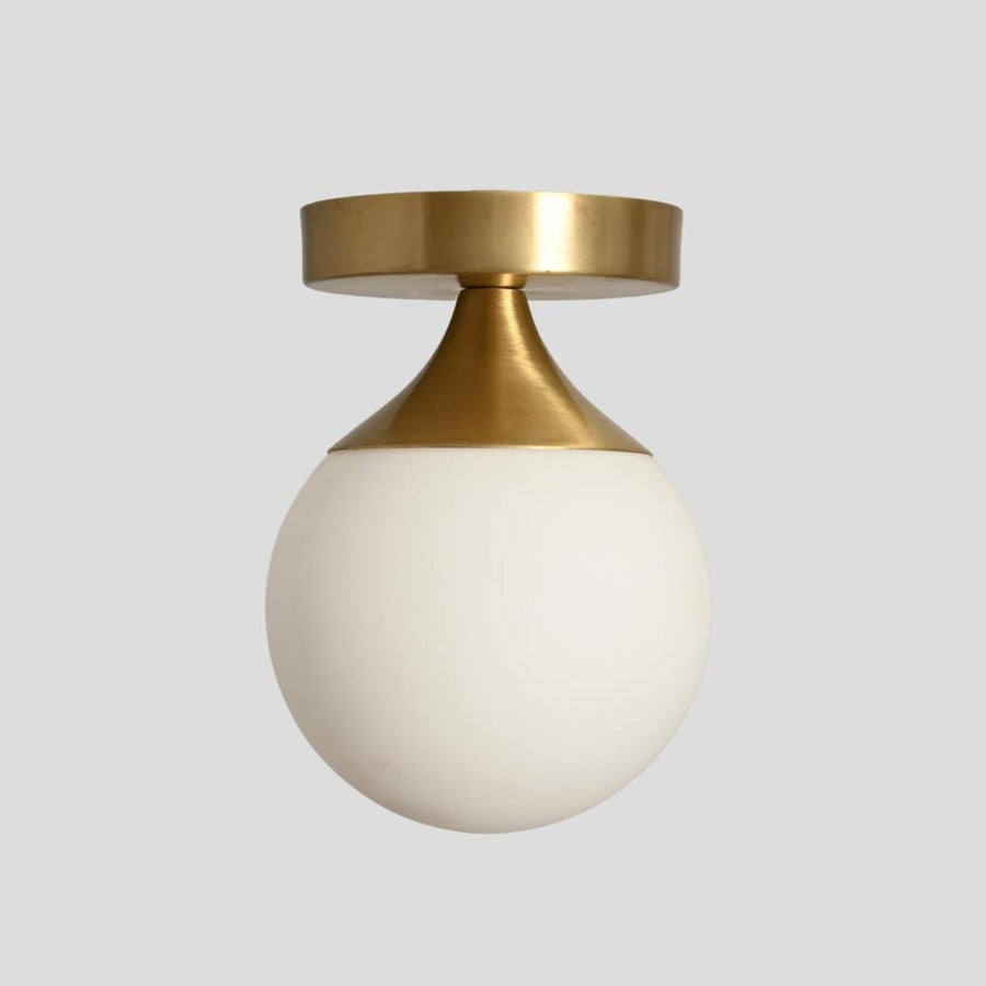 Handmade brass flush mount ceiling light with conical mount and opal glass globe – modern minimalist design