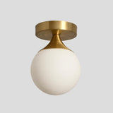 Solid brass flush mount light with tapered cone holder and opal globe – elegant handcrafted ceiling fixture