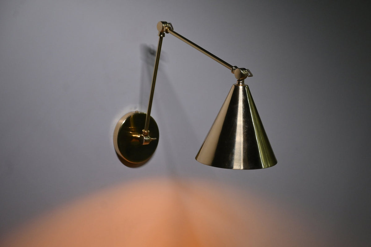 Brass cone wall sconce angled side view, handmade industrial lighting