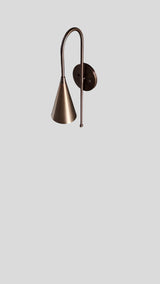Angled rear view of brass cone wall sconce showcasing curved mounting arm