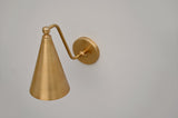 Top view of brass cone wall sconce with smooth brushed finish and elegant curved arm, handcrafted by Brass Leaf Studio.