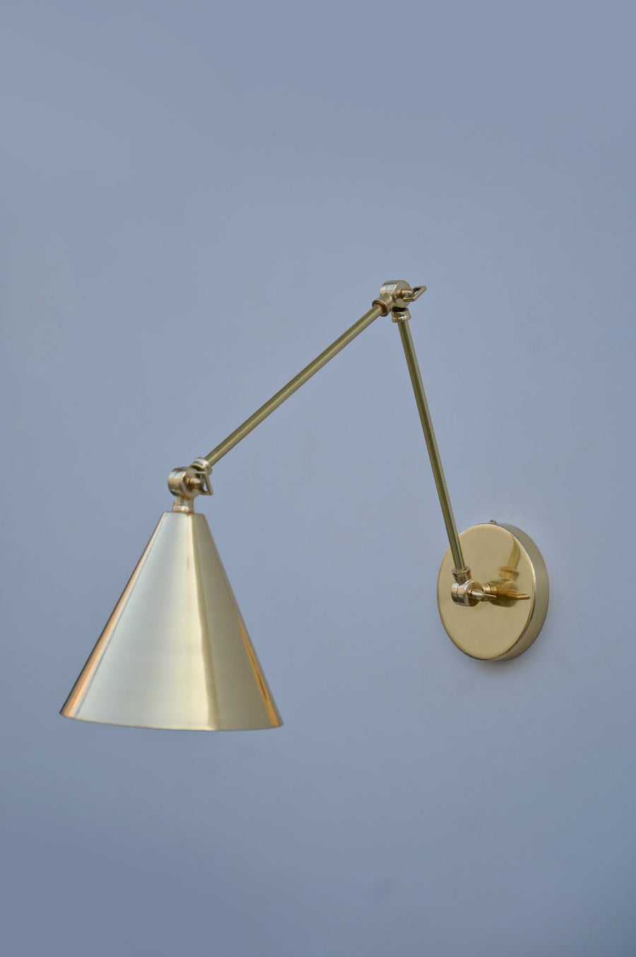 Brass adjustable conical shade wall light with pivot arm, modern handmade design