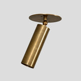 Handmade brass cylinder ceiling spotlight with adjustable head, minimalist industrial style lighting fixture.