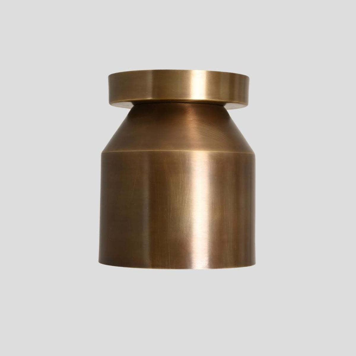Side view of solid brass cylinder flush mount ceiling lamp in brushed finish