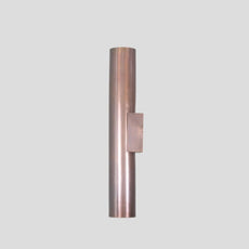 Side view of minimalist brass cylinder wall sconce, solid brass construction with brushed finish, designed for modern interiors.